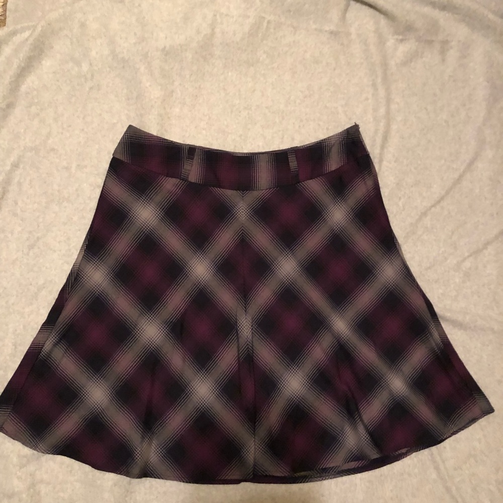 NYCO knee length purple plaid skirt.